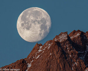 Full moon setting over alabama Hills, California