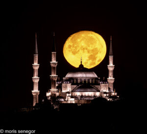 Full moon setting over the Blue Mosque