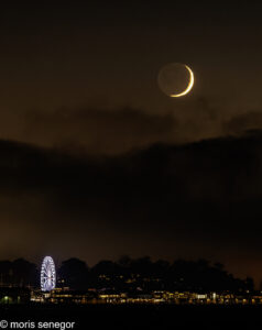 Crescent moon over Fisherman's Wharf, San Francisco