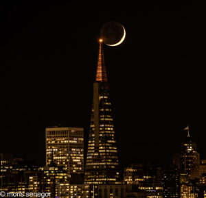 Crescent moon setting over Transamerica Building, San Francisco